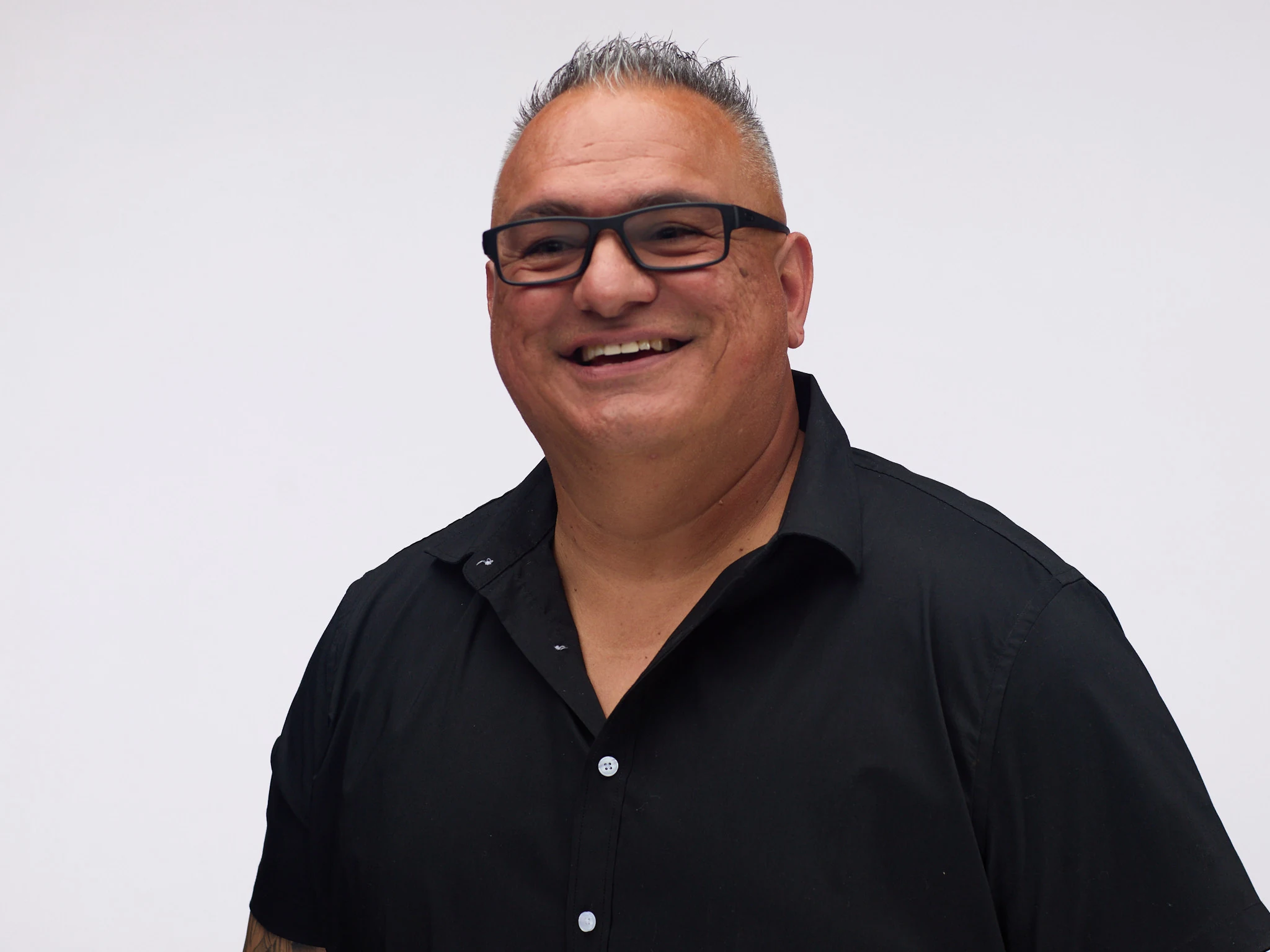 DJ Big Al smiling in a professional portrait